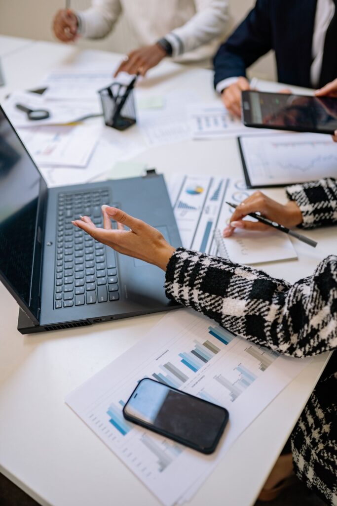 Public sector project team reviewing information on a laptop during a meeting