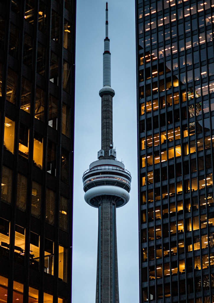 The CN Tower between two skyscrapers. Toronto is not the capital of Canada’s government, but it is for AI strategy